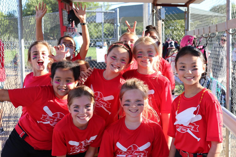 T&C Sports softball team in dugout