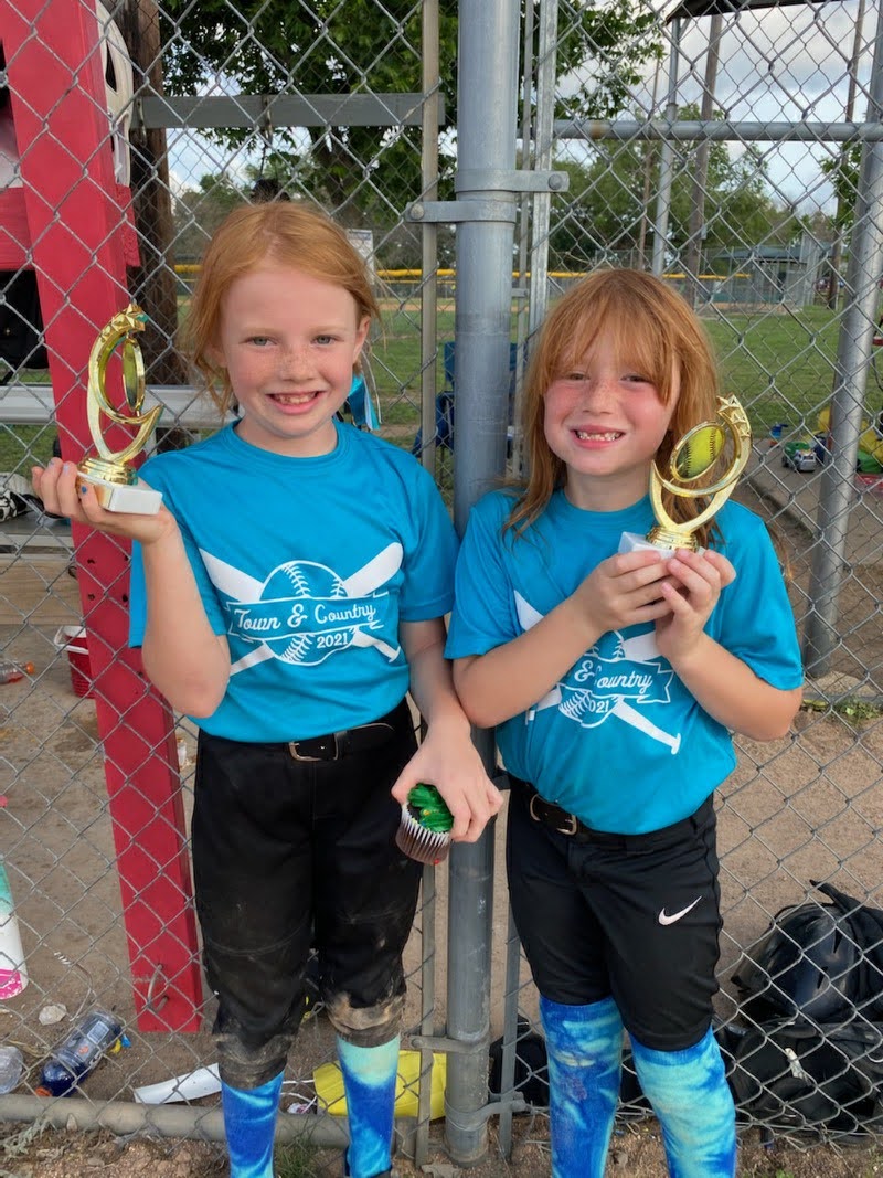 softball players with trophies